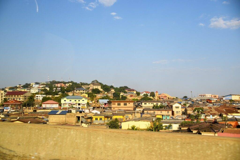 ghana road trip, road side view of houses in rural ghana